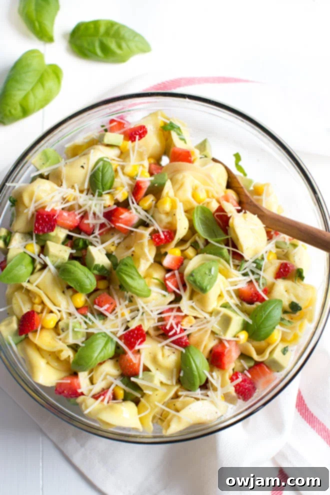 Strawberry Corn and Avocado Tortellini Salad, a unique blend of sweet and savory.