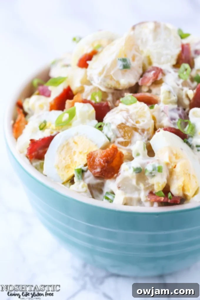 Creamy Potato Salad with Bacon and Eggs, a classic comfort food.