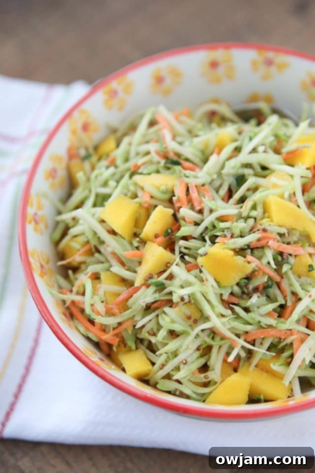 Tangy Mustard Broccoli Slaw Salad with Mango, a sweet and savory crunchy salad.