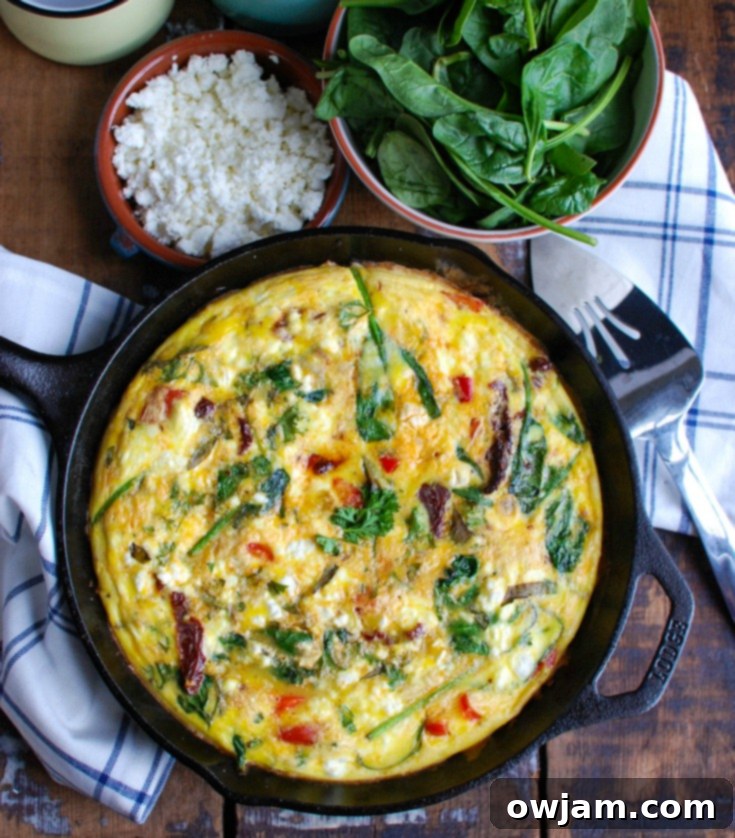 Sun-Dried Tomato Goat Cheese Frittata is a savory breakfast packed with healthy, filling ingredients. Sun-Dried tomatoes, spinach, red bell pepper, goat cheese and eggs are cooked and then baked to perfection. Serve this at a brunch or make it ahead of time for a quick weekday breakfast.