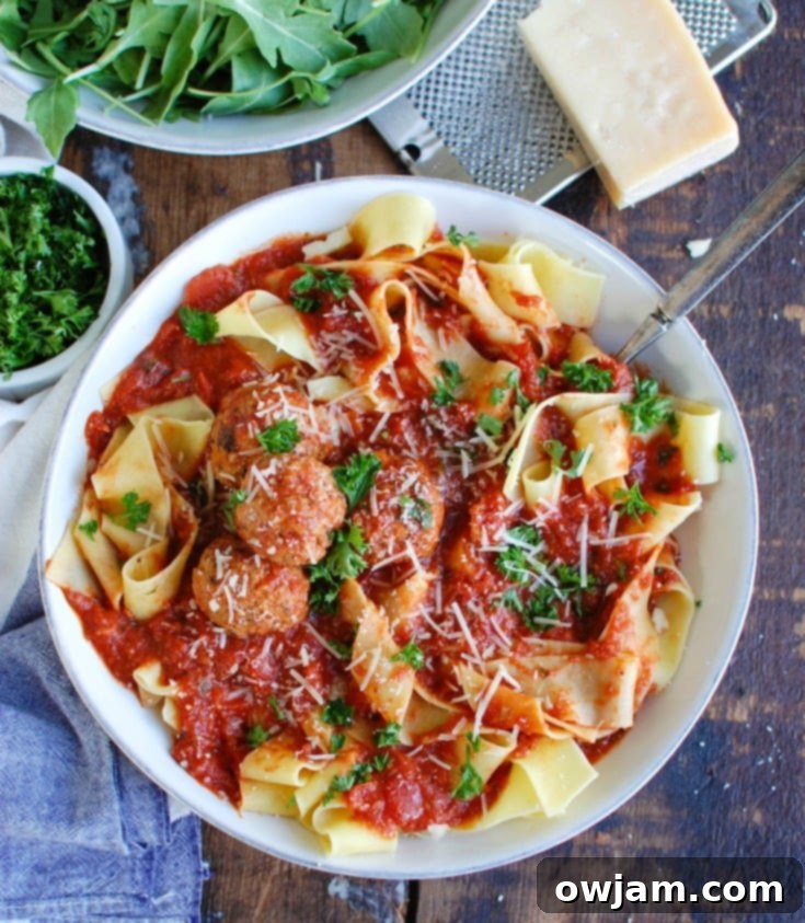 Tender Slow Cooker Veal Meatballs 7 Slow Cooker Veal Meatballs with spoon.
