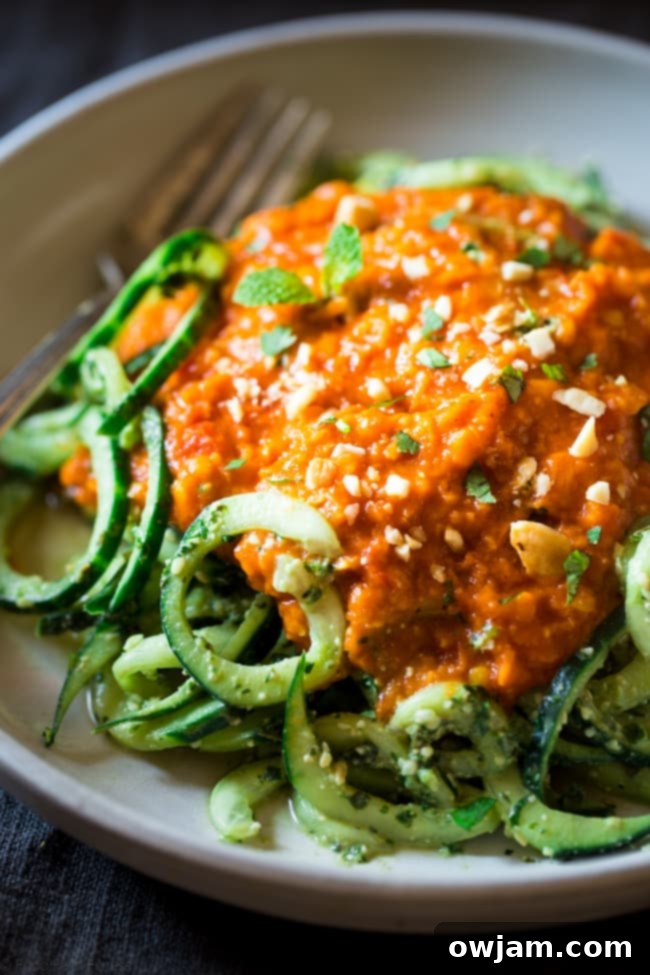 Lentil coconut curry served with cashew cilantro pesto and refreshing cucumber noodles.