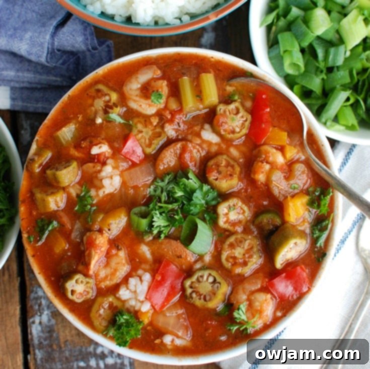 Crock-Pot Jambalaya Soup is rich with flavor and spice and packed with delicious New Orleans flavors. Chicken, andouille sausage and shrimp are simmered in a cajun spiced tomato broth and served with rice. This is comforting and a great meal to share with others!