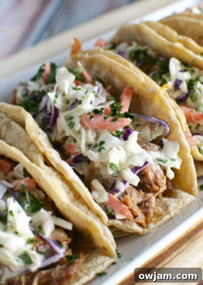 14 Essential Pork Recipes 5 Delicious Barbecue Pork Tacos topped with a vibrant Honey Mustard Slaw.
