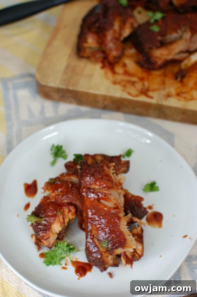 Slow Cooker Ribs 4 Slow Cooker Barbecue Ribs are fall off the bone tender and full of warm spices and flavor. These ribs cook in a slow cooker saving you time and making this meal easy and perfect for a crowd!