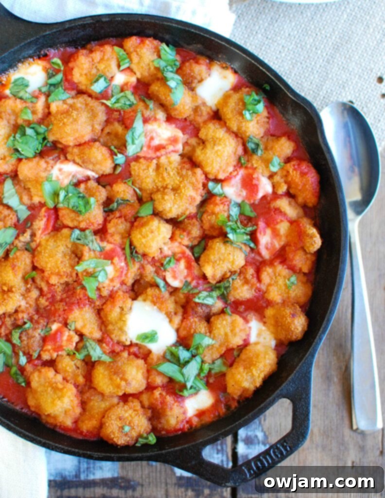Festive Tomato Basil Mozzarella Popcorn Shrimp Bites arranged for a holiday party, showcasing their vibrant red, white, and green colors.