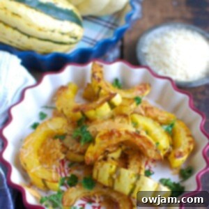 Roasted delicata squash with Parmesan cheese, ready to serve.