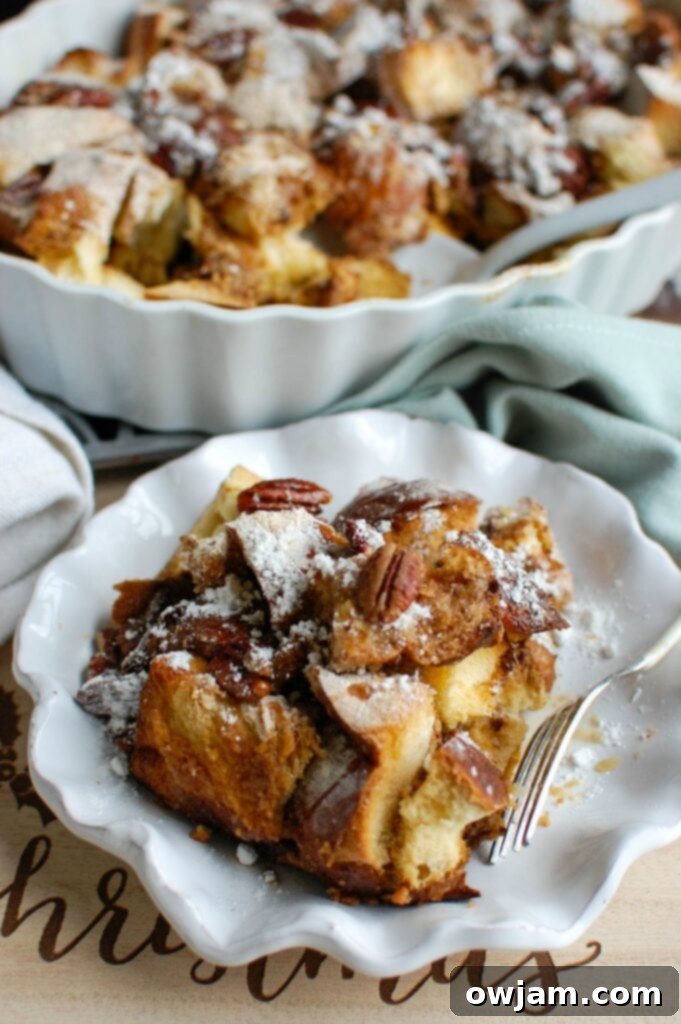 Festive Overnight Gingerbread French Toast Casserole 3 Close-up shot of the unbaked Overnight Gingerbread French Toast Casserole, showing the bread soaking in the rich custard.