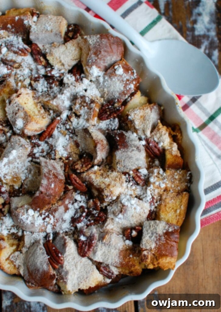 Festive Overnight Gingerbread French Toast Casserole 6 The baked Overnight Gingerbread French Toast Casserole, golden brown and garnished, ready to be served.