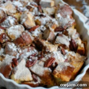 Festive Overnight Gingerbread French Toast Casserole 8 Overnight Gingerbread French Toast Casserole garnished with powdered sugar.