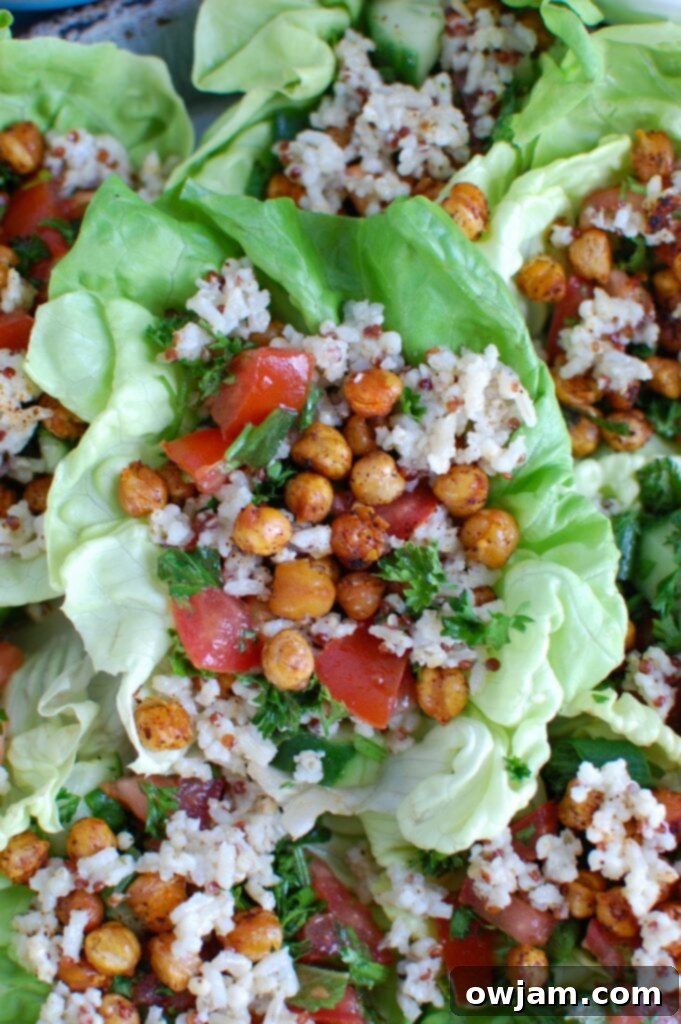 Close-up of Mediterranean Sorghum Tabbouleh and Chickpea Lettuce Wraps, showcasing a light, healthy meal with vibrant Lebanese flavors and a blend of sorghum, quinoa, brown rice, fresh tabbouleh, and roasted chickpeas in a lettuce cup.