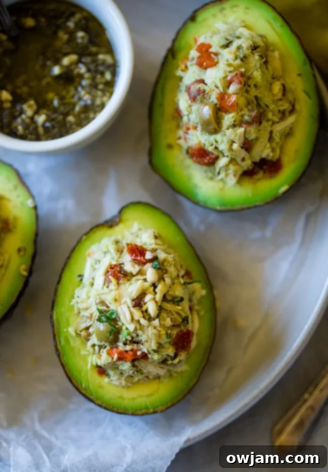 This healthy tuna salad has a Mediterranean twist and is served in a stuffed avocado! It has no mayo and is an easy, gluten free and low carb meal with only 6 ingredients!