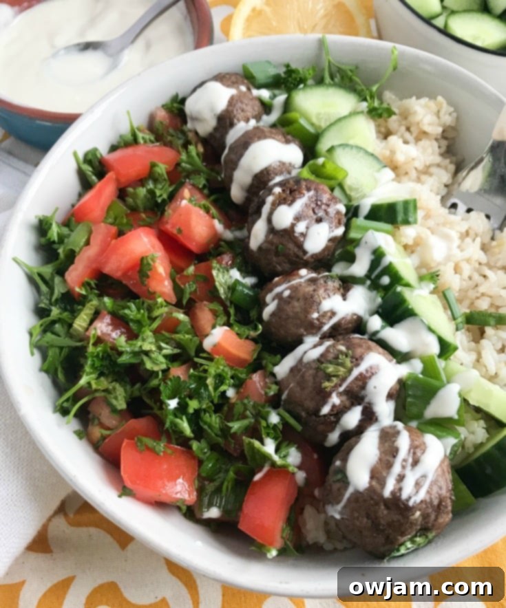 Juicy Beef Kafta Meatballs in a bowl with a serving spoon