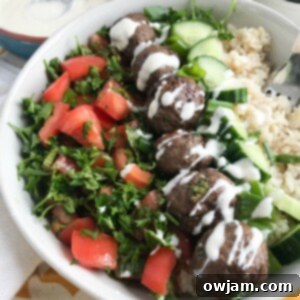 Aromatic Kafta Beef Meatballs 6 Beef Kafta Meatballs with a spoon, top down view
