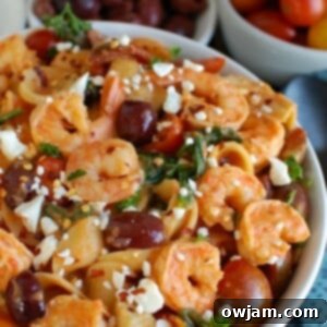 Easy One-Pot Mediterranean Shrimp Pasta 7 Top-down view of One Pot Mediterranean Shrimp Pasta in a rustic bowl.