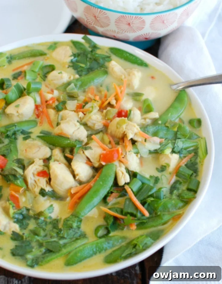 Go-To Green Curry Chicken 3 Side view of Easy Green Curry Chicken served in a bowl, showcasing its rich texture and colorful ingredients.