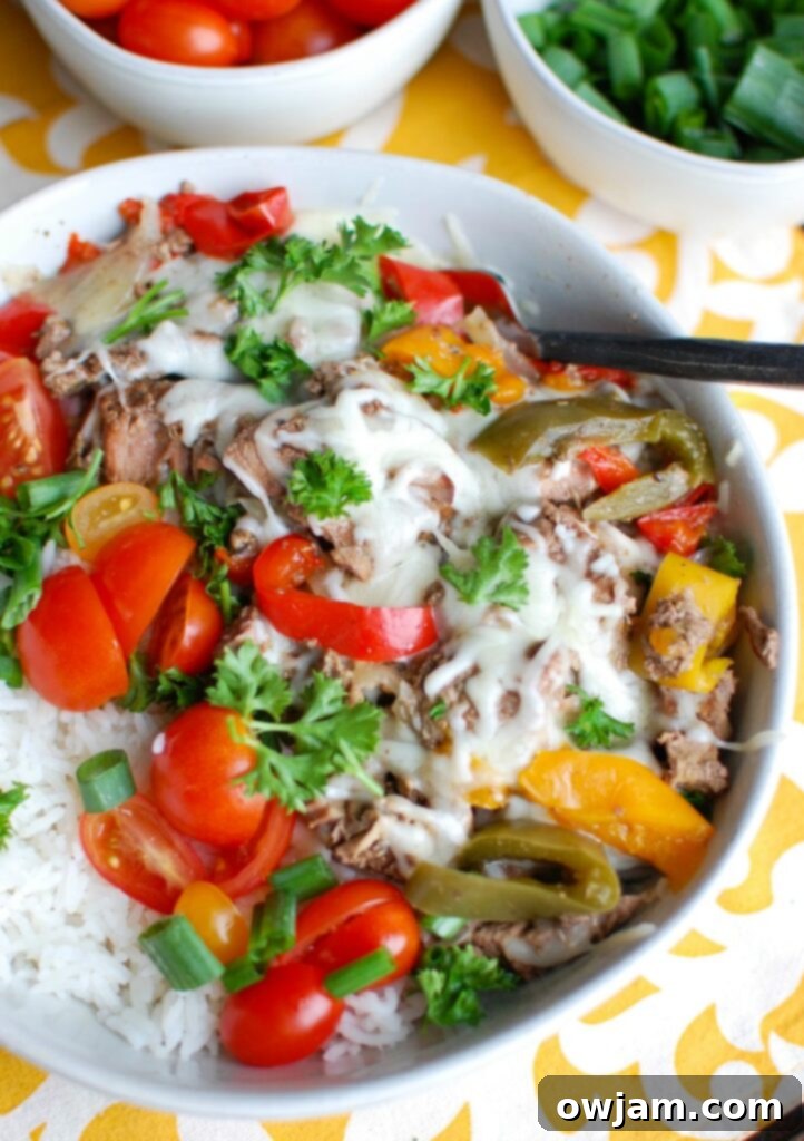 Set-and-Forget Philly Cheesesteak Rice Bowls 3 Overhead shot of Slow Cooker Philly Cheesesteak Rice Bowls with various toppings