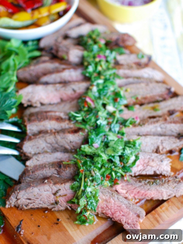 Succulent Grilled Flank Steak & Zesty Chimichurri 3 Grilled Flank Steak Resting on a Cutting Board with Chimichurri Sauce