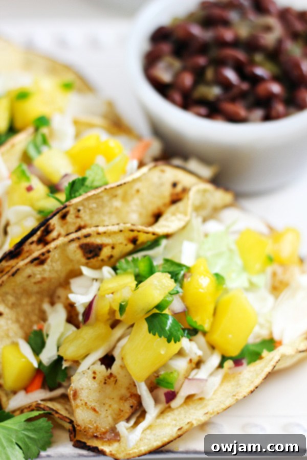 19 Fresh & Healthy Seafood Delights 14 Flaky baked tilapia fish tacos loaded with fresh toppings and a creamy sauce, offering a lighter and healthier twist on traditional fish tacos.