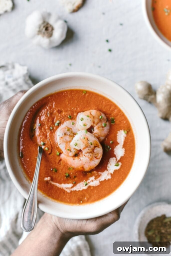 19 Fresh & Healthy Seafood Delights 17 A rich and aromatic curry tomato soup topped with perfectly roasted cumin-spiced shrimp, creating a comforting and flavorful meal.