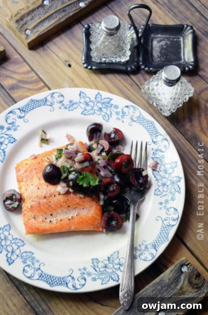 19 Fresh & Healthy Seafood Delights 8 Perfectly seared salmon served with a unique and vibrant fresh cherry and charred poblano chopped salad, offering a delicious paleo and Whole30 compliant meal.