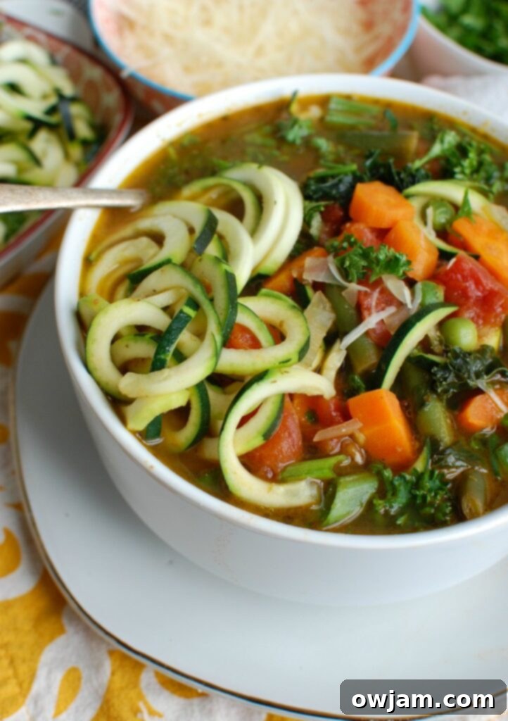 Vibrant Spring Minestrone 4 A close-up shot of Spring Vegetable Minestrone in a bowl, with a spoon resting in it, showcasing the rich texture and colorful ingredients, inviting a taste.