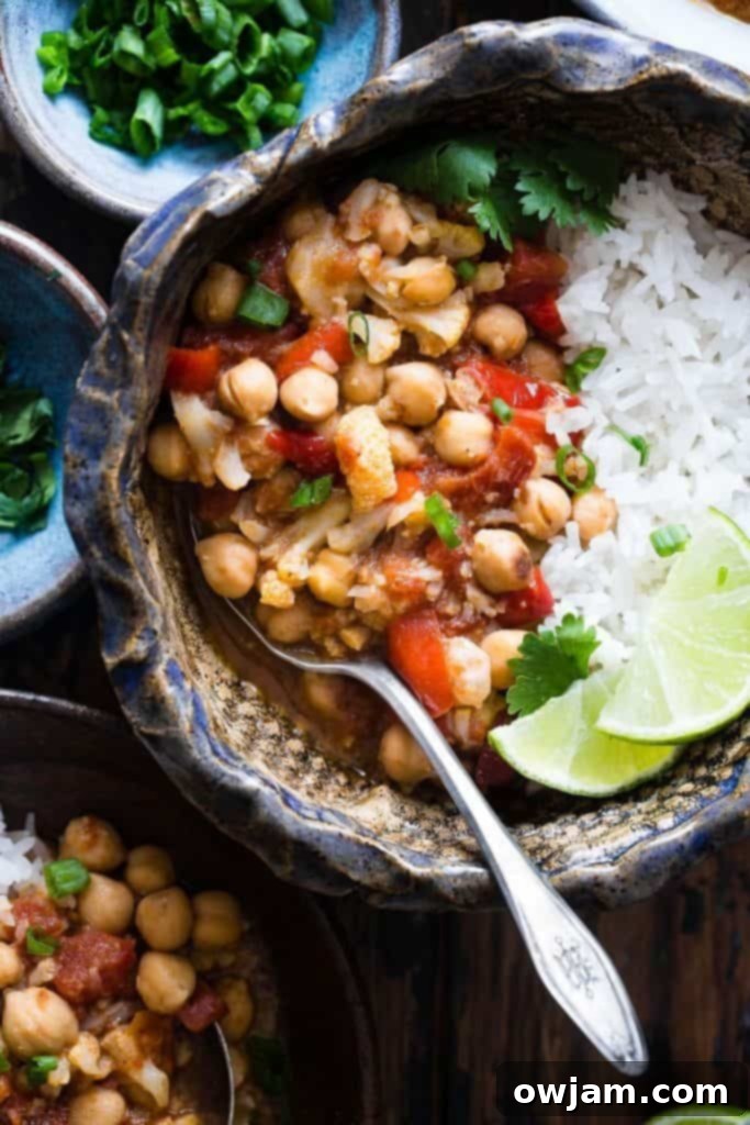 13 Instant Pot Recipes You'll Crave 9 A vibrant and aromatic bowl of Easy Vegan Cauliflower Chickpea Curry, rich with spices, tender cauliflower florets, and protein-packed chickpeas.