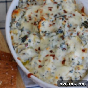 Zesty Lemon Spinach Artichoke Dip 6 Lemon Spinach Artichoke Dip in white bowl