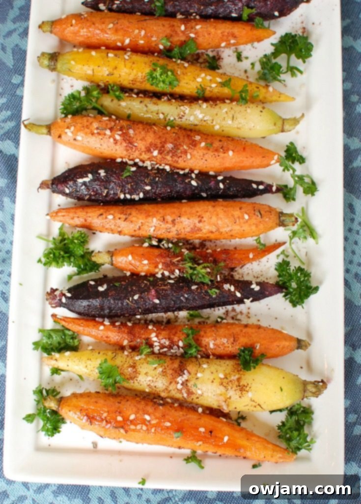 Ingredients for Za'atar Roasted Carrots laid out: carrots, olive oil, za'atar, garlic, salt, pepper, and fresh parsley.