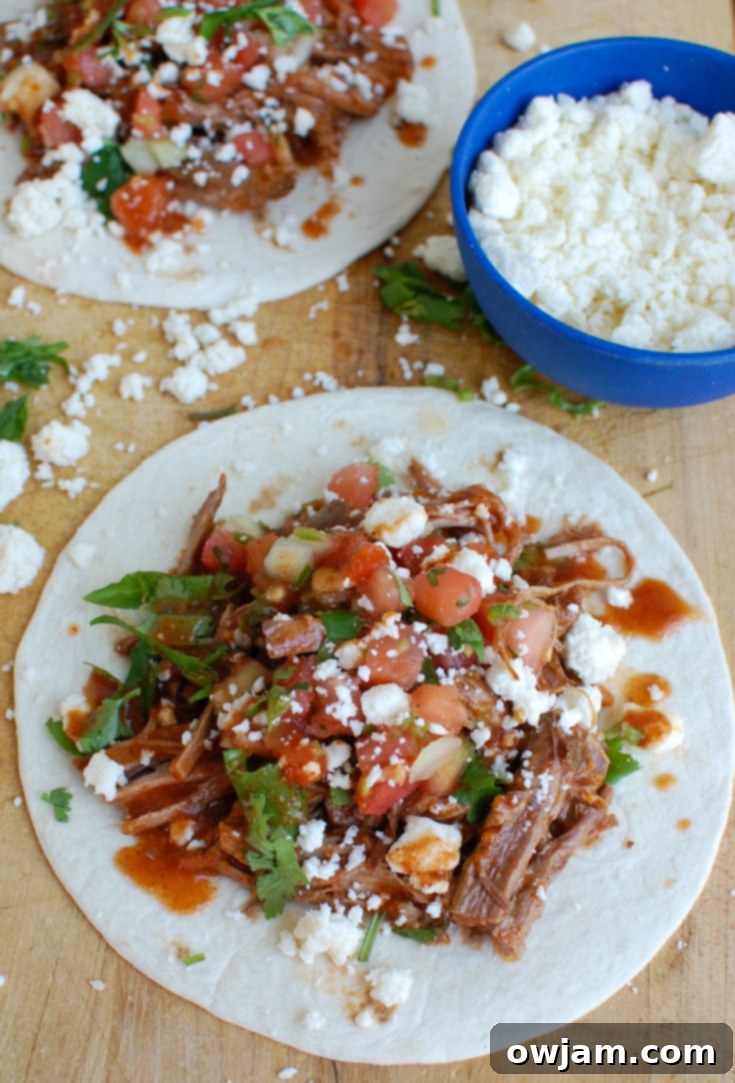 Close-up of Slow Cooker Mexican Beef Brisket taco with fresh toppings