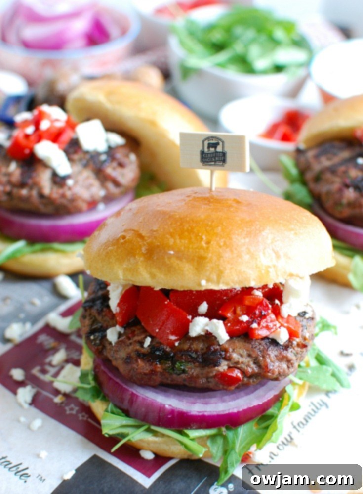 Easy Mediterranean Burgers on buns with roasted red peppers and feta