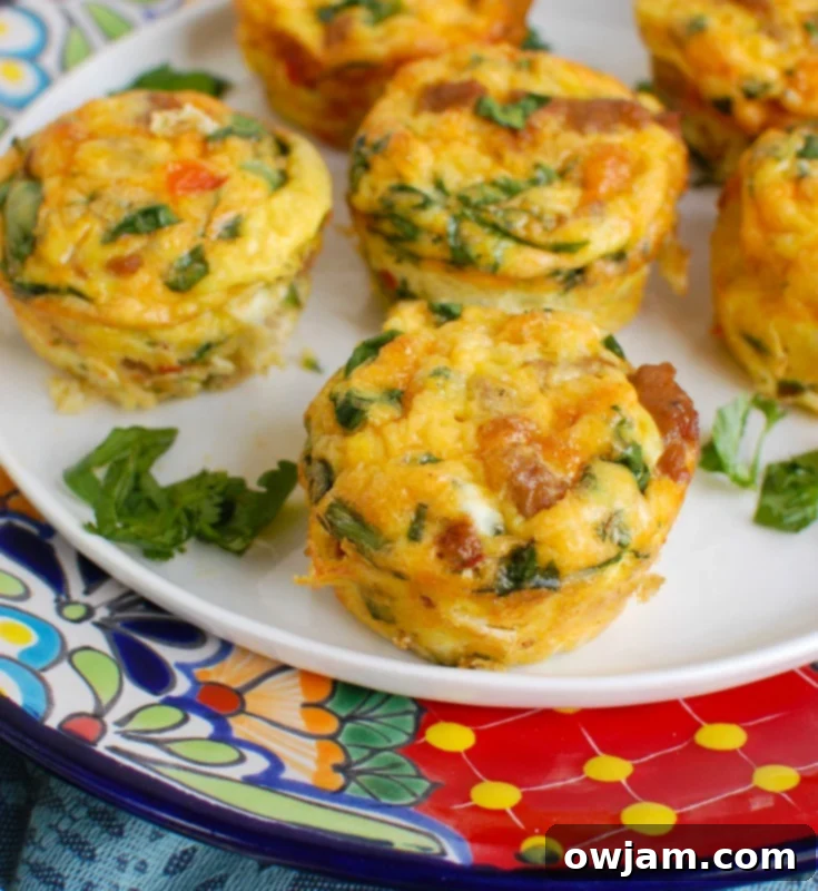 Southwestern Turkey Sausage Egg Muffins 2 Southwestern Turkey Sausage Egg Cups on white plate, ready to be enjoyed.