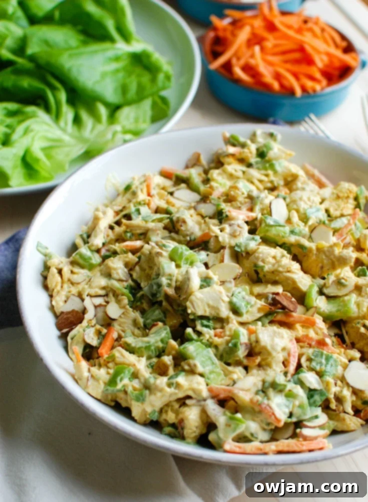 11 Effortless Chicken Salad Recipes 3 Simple Curry Chicken Salad, a lightened version with Greek yogurt, mayonnaise, honey, curry, golden raisins, shredded carrots, chopped celery, green onion, and parsley.