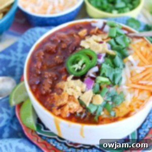 Quick Instant Pot Beef Chili 7 A bowl of Easy Instant Pot Beef Chili, garnished and ready to eat.