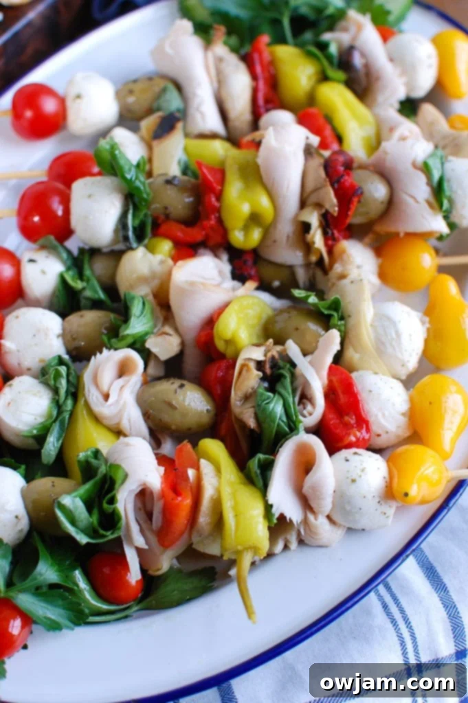 Close-up of Mediterranean Antipasto Skewers featuring Kretschmar Off The Bone turkey breasts, olives, and mozzarella balls.