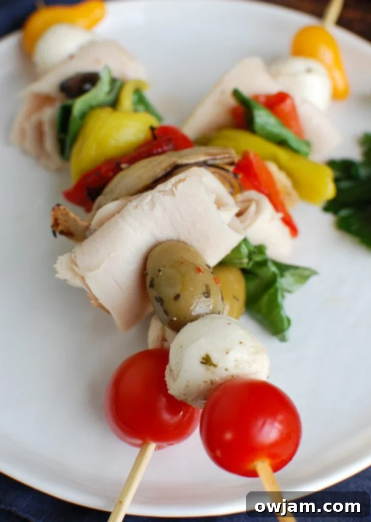 Two Mediterranean Antipasto Skewers, beautifully arranged and ready to be served.