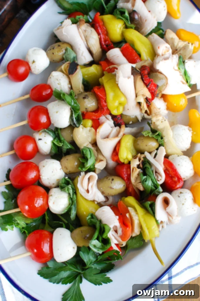 Overhead view of several Mediterranean Antipasto Skewers featuring a beautiful arrangement of Kretschmar Off The Bone turkey, olives, mozzarella, and vegetables.