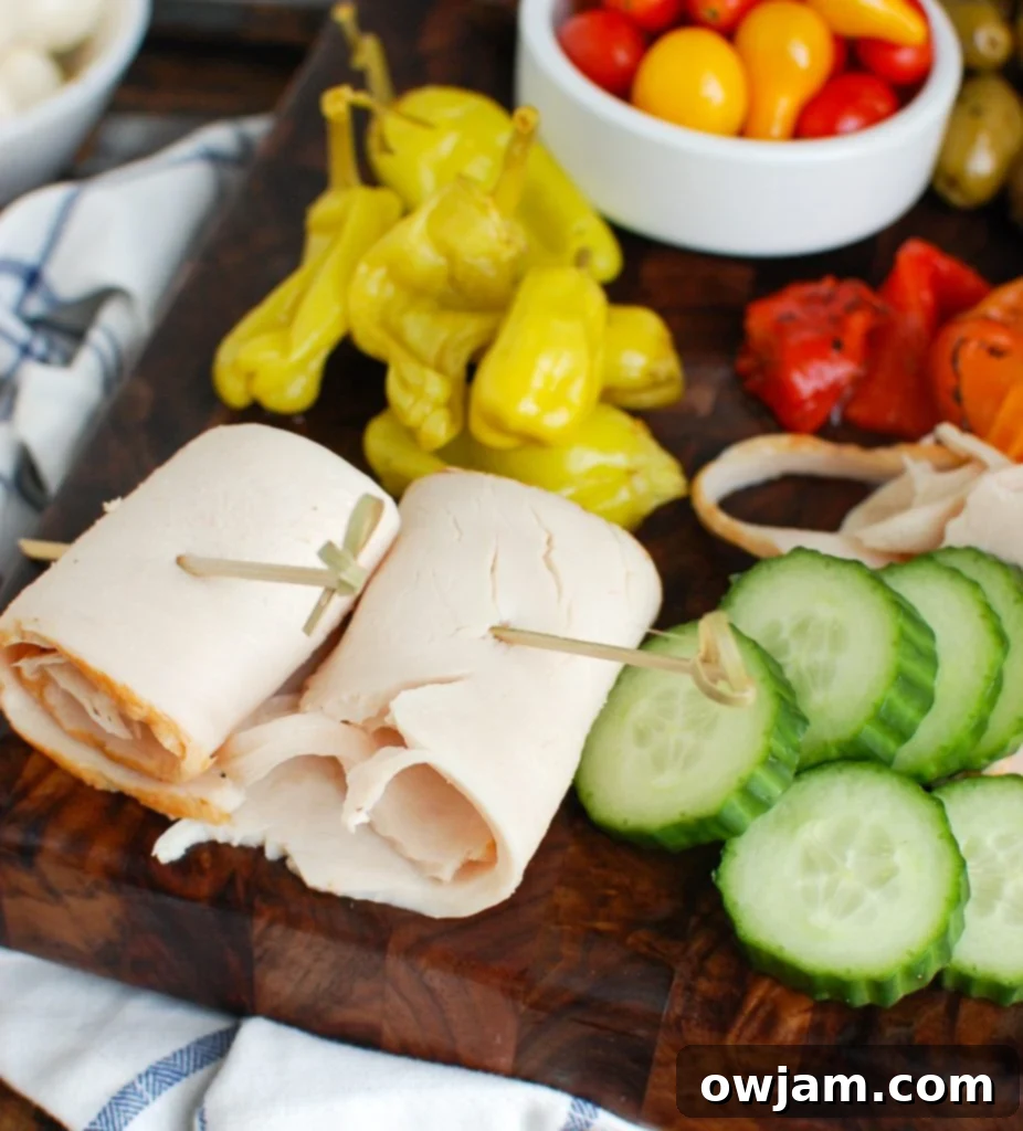 A close-up of a Mediterranean Antipasto Skewer, highlighting the rolled Kretschmar Off The Bone turkey and vibrant fresh ingredients.