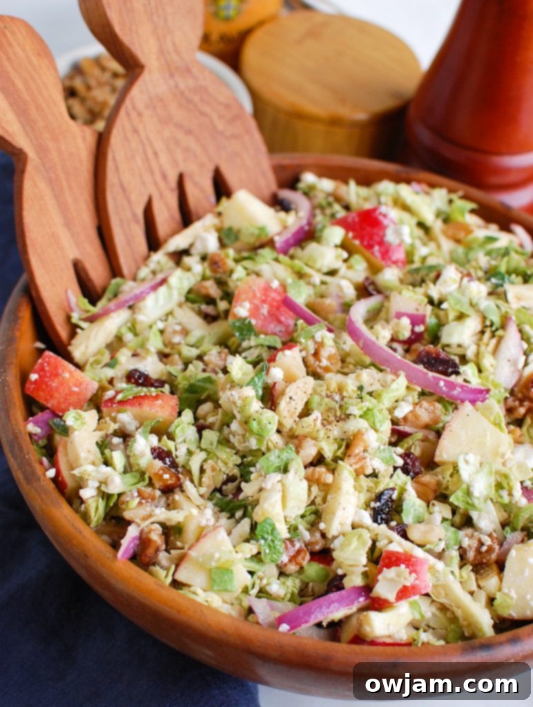 Tangy Goat Cheese, Crisp Apple & Shaved Brussels Sprout Salad 2 Brussels Sprout Apple Goat Cheese Salad Wooden Bowl with fresh ingredients