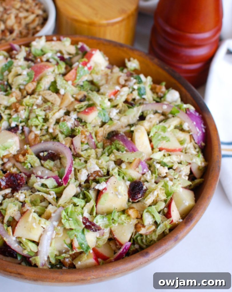 Tangy Goat Cheese, Crisp Apple & Shaved Brussels Sprout Salad 5 Brussels Sprout Apple Goat Cheese Salad Wood Bowl with Tongs