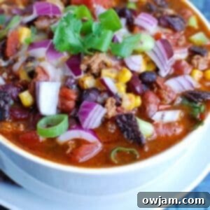 Effortless Instant Pot Turkey Chili 7 Instant Pot Turkey Chili in a white bowl, ready to serve.