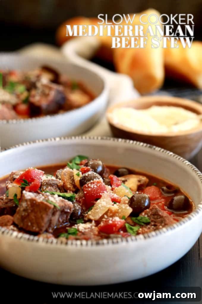 9 Mouthwatering Mediterranean Slow Cooker Creations 7 A hearty bowl of Slow Cooker Mediterranean Beef Stew, featuring tender beef chunks, colorful bell peppers, zucchini, and tomatoes in a rich, herby sauce.