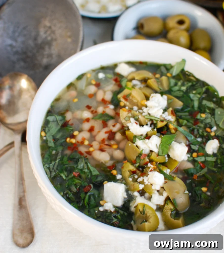 Mediterranean White Bean Soup topped with olives and a drizzle of olive oil