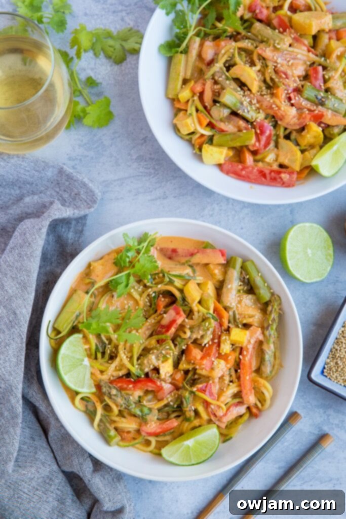 Vegan Red Curry Zucchini Noodle Bowls - A colorful bowl of vegan red curry with zucchini noodles, fresh vegetables, and a creamy red curry sauce.