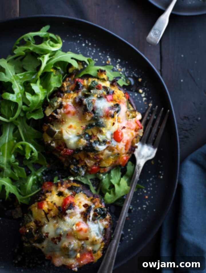 Vegetable Stuffed Portabella Mushrooms - Large portobello mushrooms generously stuffed with a colorful mixture of vegetables and grains, baked to perfection.