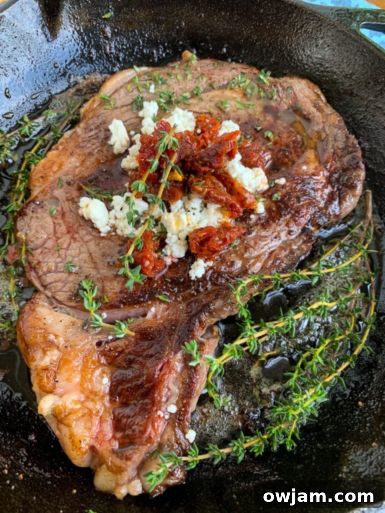 Pan-Seared Ribeye Steaks with Creamy Goat Cheese and Sweet Sun-Dried Tomatoes 2 Pan-Seared Ribeye with Goat Cheese and Sun-dried Tomatoes in Skillet