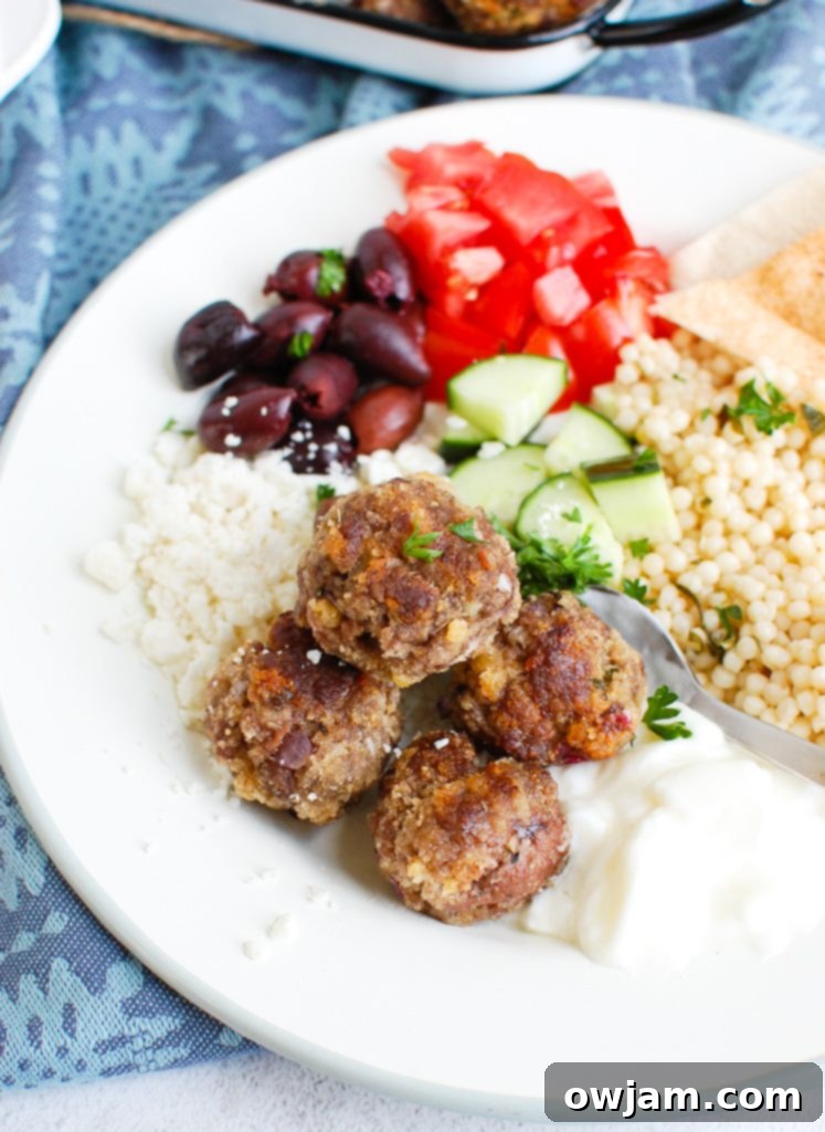 Greek Keftedes 2 Plate of perfectly cooked Greek Meatballs garnished with fresh herbs