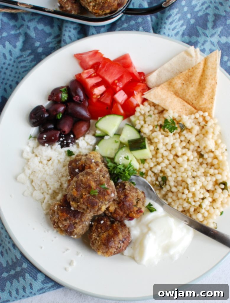 Greek Keftedes 4 Close-up of Greek Meatballs in a bowl, with a spoon for serving