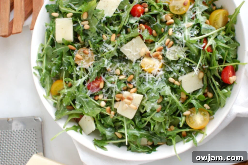Bright Lemon Arugula Parmesan Salad 4 Lemon Arugula Salad with Pine Nuts in bowl