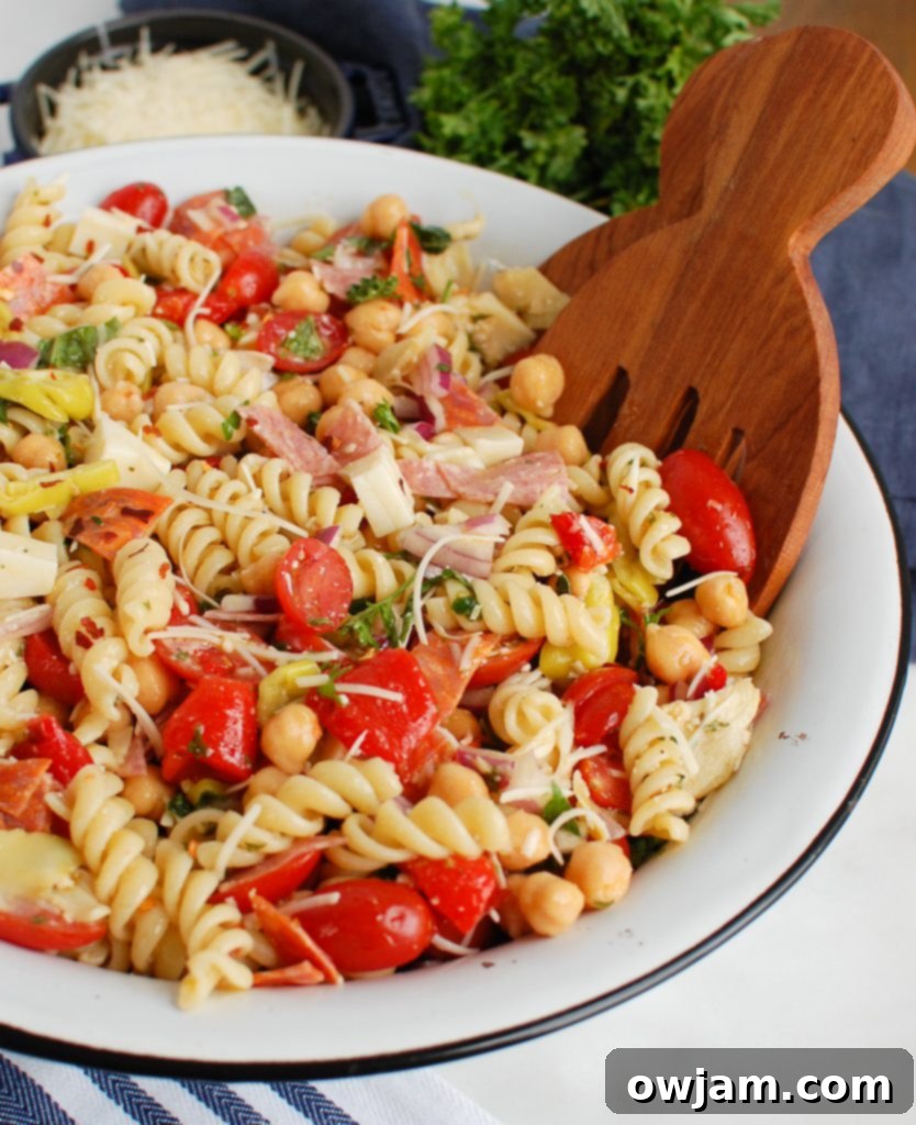 Vibrant Italian Pasta Salad served in a white bowl, ready for a summer picnic or gathering